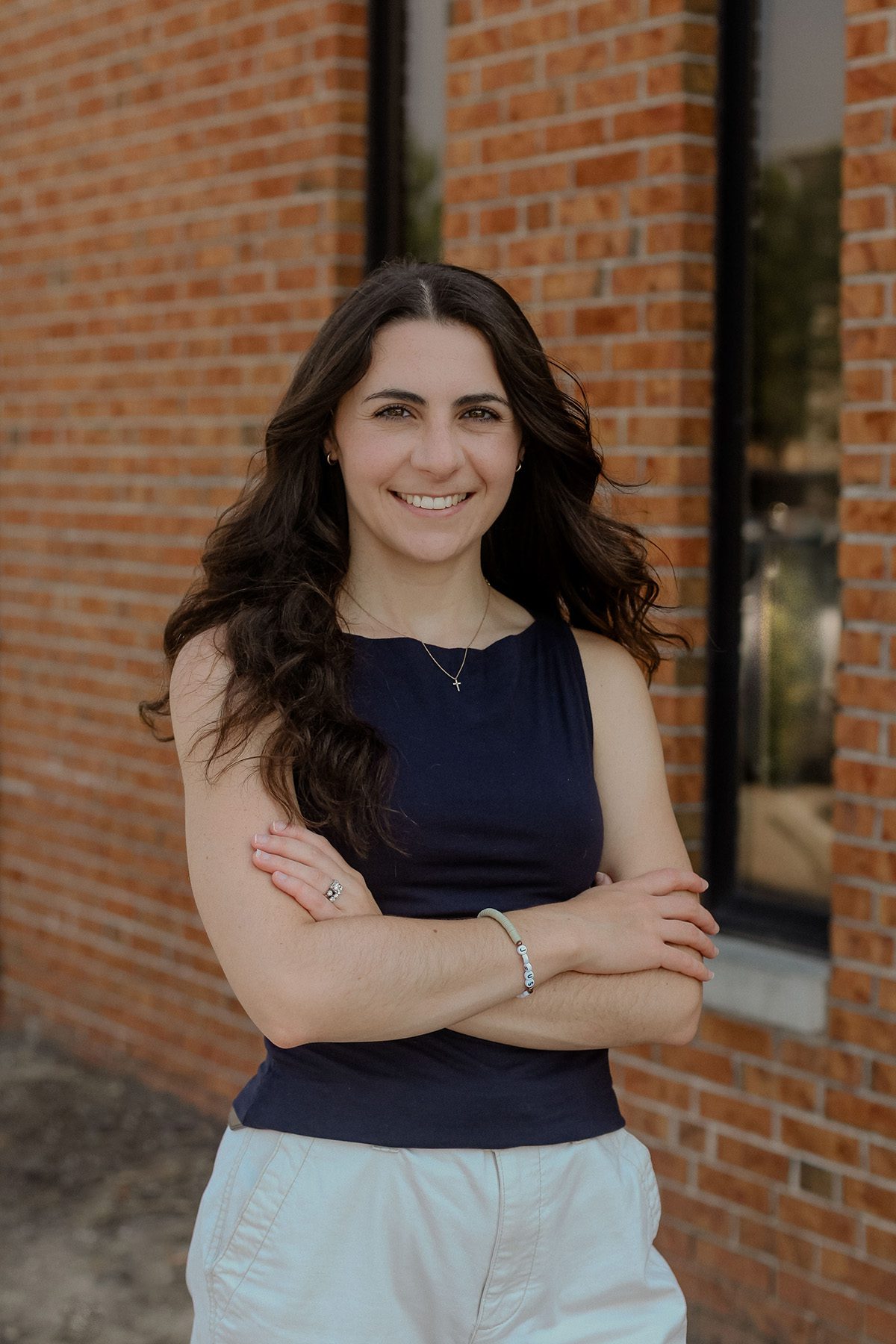 Headshot of Bridget Clevenger, Cork Tree Creative's Senior Account Executive standing outside smiling