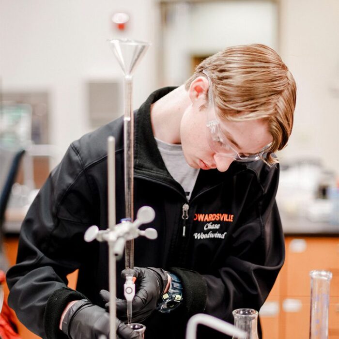 Young man working in science lab through Gateway Apprenticeship Hub