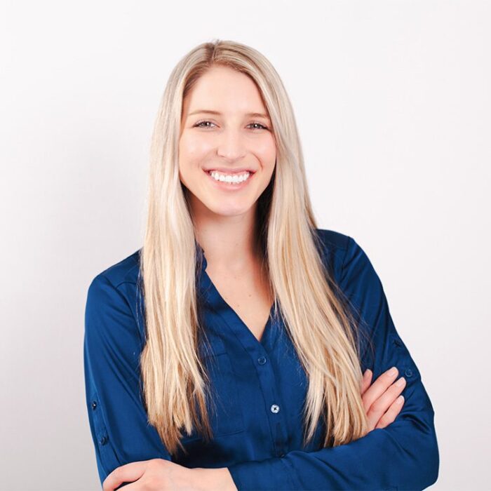 Headshot of smiling young woman, taken by Cork Tree Creative