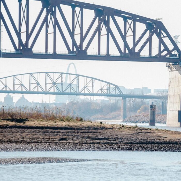 Two bridges over Mississippi River, the St. Louis arch and skyline in background