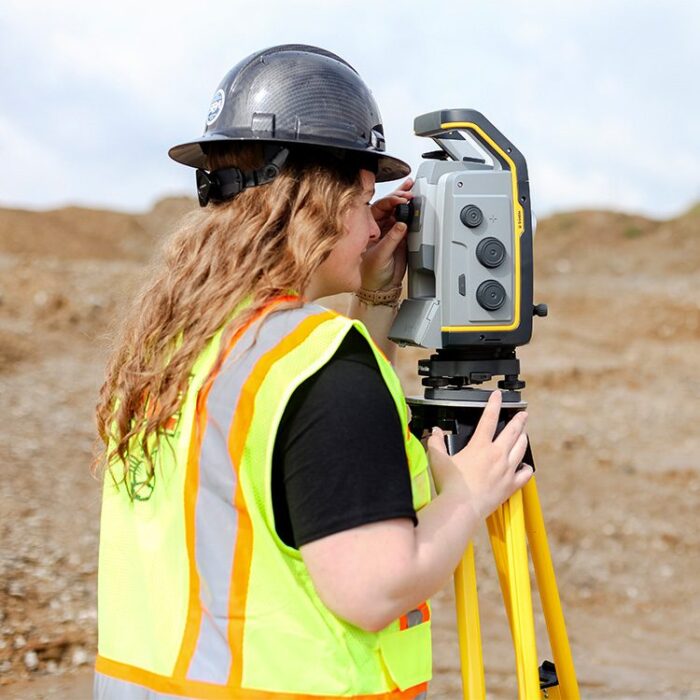 Female construction surveying student at SIUE on construction site
