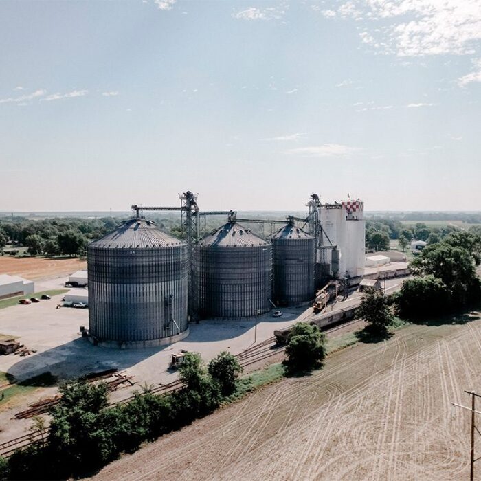 Aerial view of grain silos in farm field